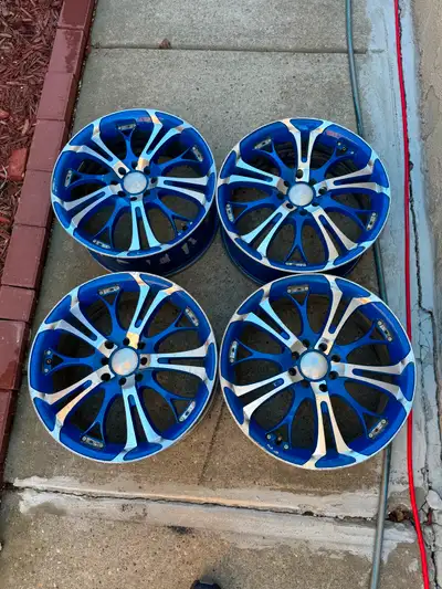 Selling 4 x 17 inch Blue Rims 4x100 and 4x114.3 Bolt pattern ET40 , 17x7J , 70 center hub Slightly b...