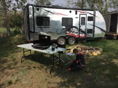 Livin Lite camper / toy hauler. Has RZR branding on various places as it was made to tie down your t...
