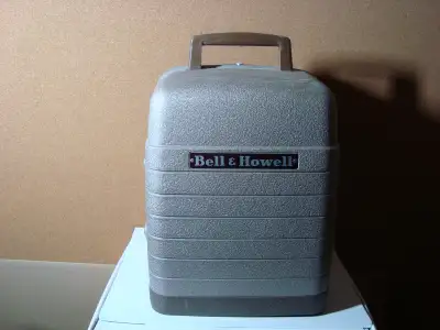 Bell & Howell 8mm Projector Model 253AX from the 50's. Still works well and in very good condition....