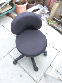 Two adjustable chairs on wheels used