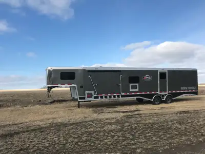 Selling our like brand new Logan Gooseneck trailer Only used 3 times. 35 feet of deck. Will fit 6 mo...