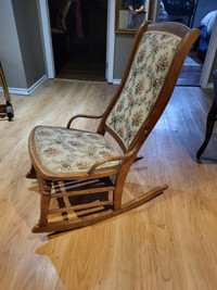 Antique small rocking chair.  High back.