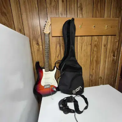 ION Strat style Sunburst electric guitar with case. Used, View more