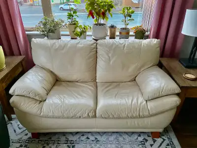 Cream leather loveseat in excellent condition, View more