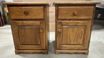 Two solid wood bedside tables (nightstands). 17"X18" and 24" high. Right and left side door openings...