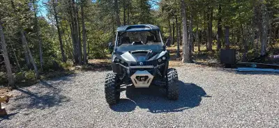 Has windshield, wind deflector, plow, rear wind screen, rear wind vinyl deflector, can am half doors...