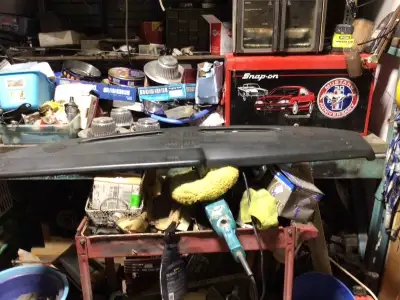 Selling a used black dash removed from a Fox body Mustang. It's in fair condition, showing some sign...