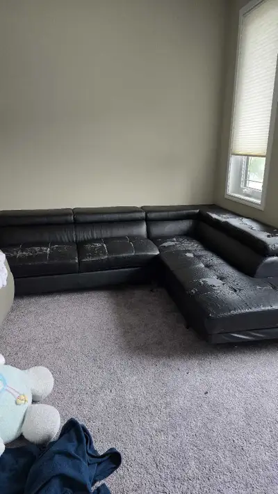 Free modern sectional. Will need to be re-upolstered but once done will be brand new. Cushions are s...