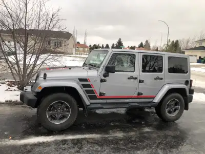 Very nice senior owned Sahara V6 auto with leather and factory remote start. Recent suspension and r...