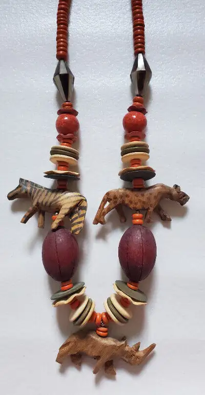 The hand carving of the zebra, rhino and leopard make this a standout one of a kind statement piece....