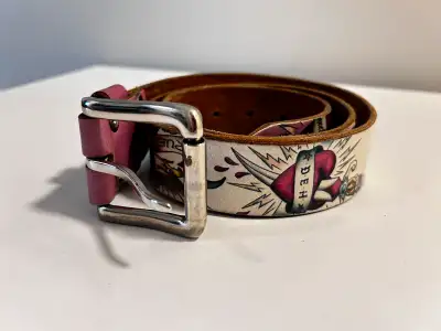 Spice up your wardrobe with this used Ed Hardy belt, showcasing a unique tattoo design and in fair c...