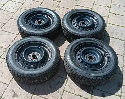 Set of four 195/65R15 Uniroyal Tiger Paw "Ice & Snow 3" Winter Tires on 15” x 6” steel rims. Tires w...