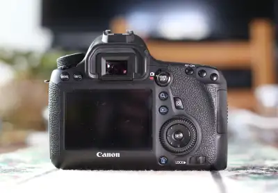 For sale a Canon DSLR model 6D with wifi. Comes with original Canon battery, charger, cap and strap.