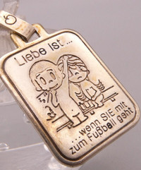 Rare vintage silver Love Is... pendant of German origin