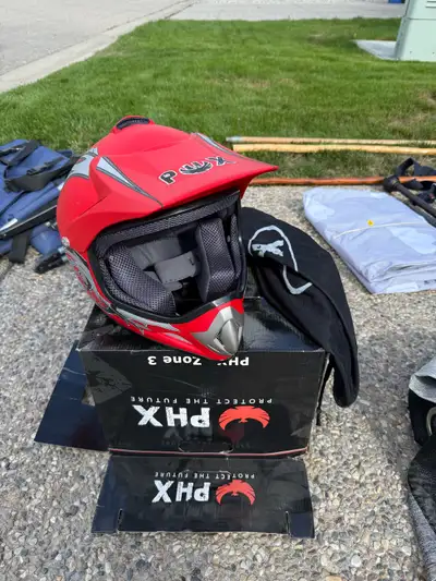 PHX Zone 3 youth motocross/dirt bike helmet in red, black and silver. In good used condition and com...