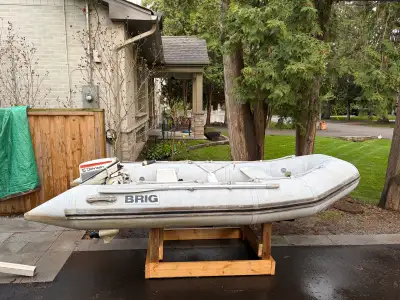 10’ Brig inflatable boat with 15hp evinrude and tank. Recently pressure tested and ready to go. Flie...