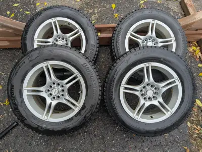 Bridgestone Blizzak WS90 215/65R16 winter tires on 16 inch aluminum rims. Tires are nearly new, driv...