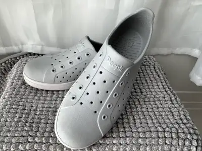 People Footwear Grey Slip-on Shoes kids size 1. These rubber slip-on shoes are grey, with a white so...