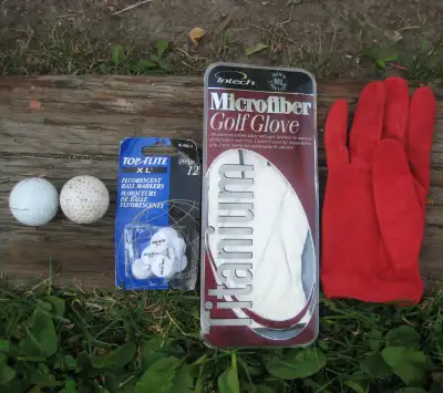 GOLF LOT: 2 Titleist ProV1X Balls, Intech New Glove, Red Glove, View more