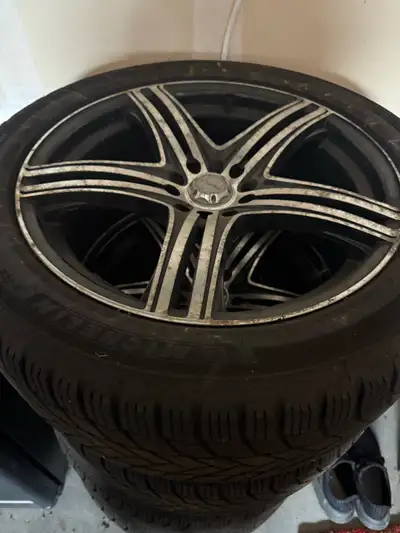 I am selling a set of four pre-owned Michelin X-Ice winter tires mounted on alloy rims, sized 245/45...