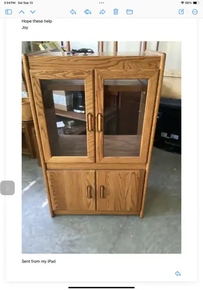 This versatile used bookcase, which can also serve as a TV stand, features a sturdy build and classi...