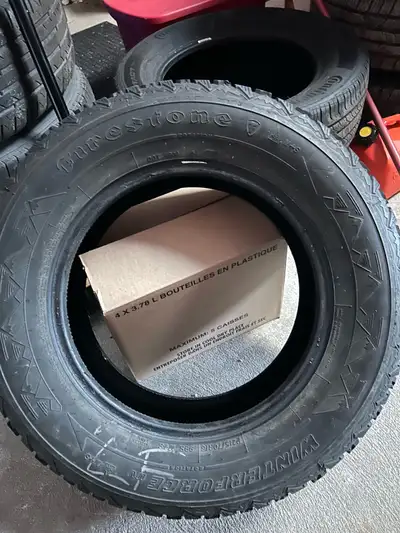 One snow tire for sale Good condition Firestone 215/70/R16