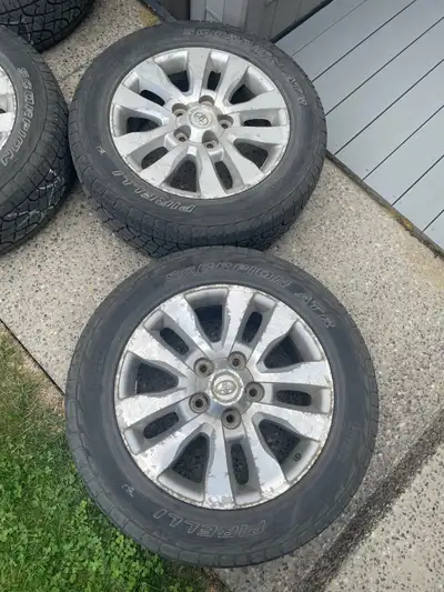 These are a set of used Tundra/Sequoia wheels with Pirelli Scorpion ATR tires, size 275/55/20, in fa...