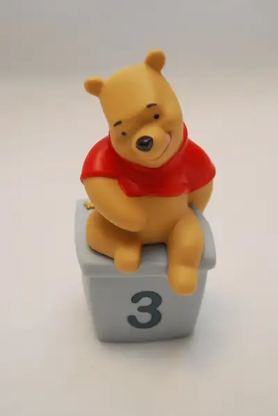 ©Disney based on the “Winnie the Pooh” works. Pooh Birthday Figurine – “THREE is for days filled wit...