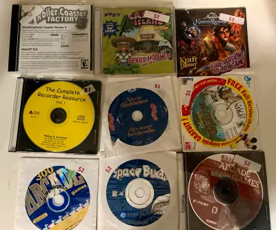 A lot of 9 PC games. Includes Roller Coaster Factory 3, Aladdin Nasira's Revenge, Alice in Wonderlan...