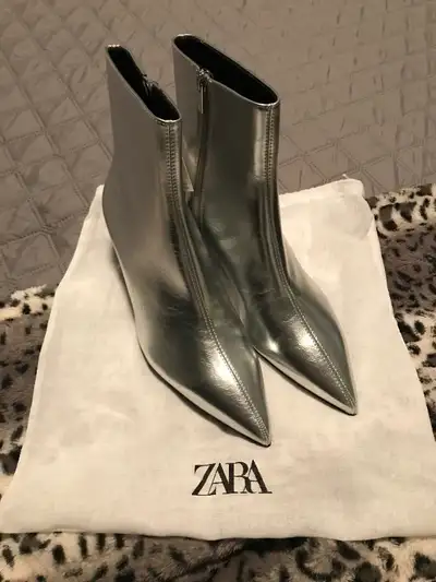 Zara silver side zipper ladies boots. Black kitten heel. Tags attached never worn. Size 9. Ordered l...