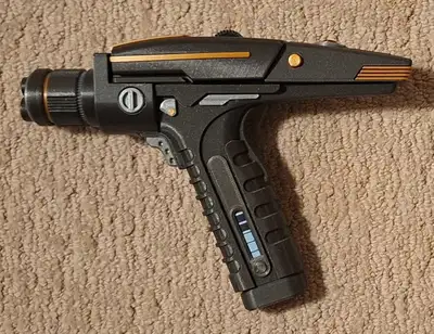 3D printed Star Trek Discovery and Strange New Worlds phaser. Discovery phaser has removable ammo cl...