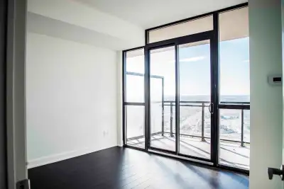 Bright and spacious 1 Bed + Den condo with 2 bathrooms, featuring 9-foot ceilings, 700 sq ft of livi...