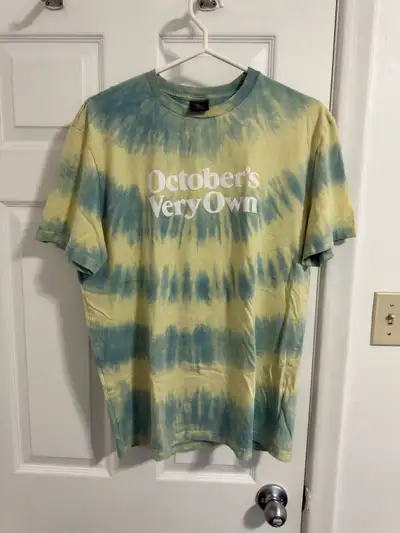 Selling an October's Very Own (OVO) tie-dye T-shirt. It's a size medium and made of 100% cotton. The...