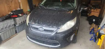 2012 ford fiesta with 271000 km on the odometer. This is a 5 speed manual. Normal wear and tear on t...