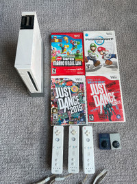 Wii + 3 controllers, Mario Kart, super Mario Bros, just dance