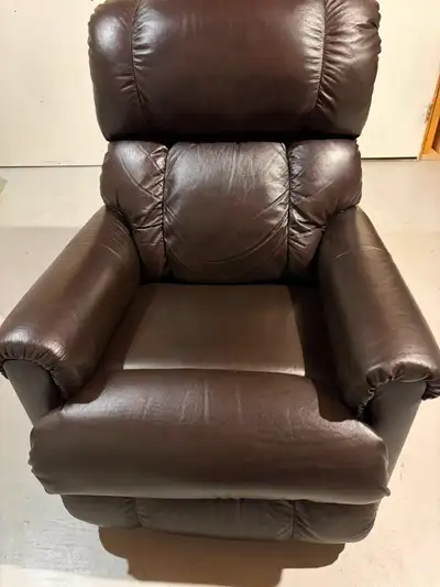 A very comfortable leather La-Z-boy brand rocker recliner. Dark Brown Chocolate Colour Leather Model...