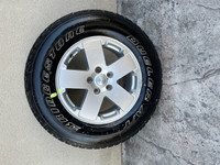 Pair of Bridgestone Dueler A/T tires on Jeep Rims with Sensors