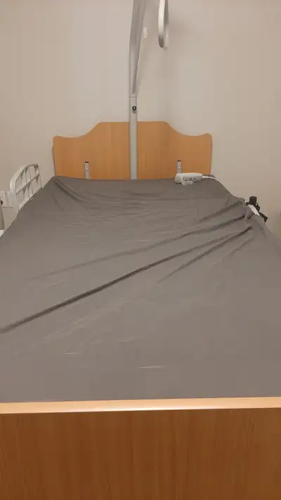 Almost new hospital bed with trapeze bar, View more