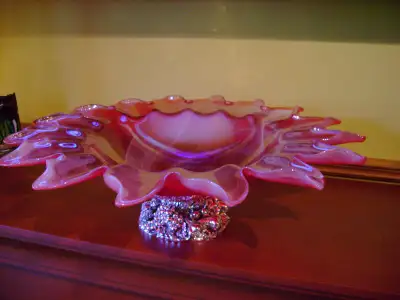 Art glass centrepiece on decorative metal foot., View more