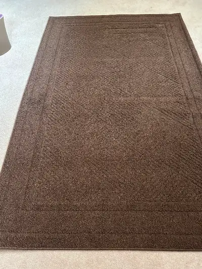 Brown Area Rug.Dimension : 60” x96” ,152 cm x243 cm Clean and ready for pick up in Red Deer Pet and...