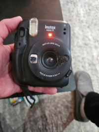 Instax mini 11 instant camera. Black, in decent shape.