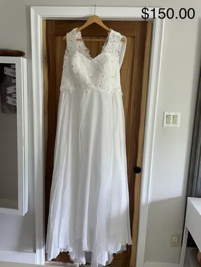 New in original packing. Bought off Amazon but descent quality. Has gems on the top and a back sash....