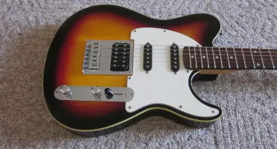 Peavey Generation EXP telecaster style electric guitar in excellent condition. New strings. Plays an...