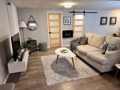 Well appointed & very clean 1 bedroom + office, 1 bath fully furnished & outfitted basement suite ....
