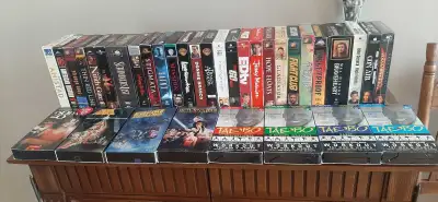 26 VHS tapes at $1.00 each or $25.00 for the lot. Some pictures have been sold.