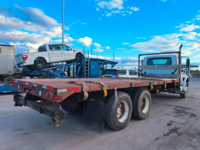 flat deck truck tandem looking for work 24 ft x 8 ft body with straps contact 902 396 8697 gord