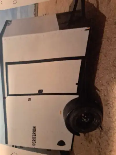 I am looking for a white 5' × 8' cargo trailer, with rear ramp door and locking side door. Touch pic...