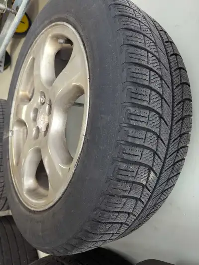 4 tires on original Subuaru rims. Used on Subaru Impreza. Tires are good for 1-2 seasons