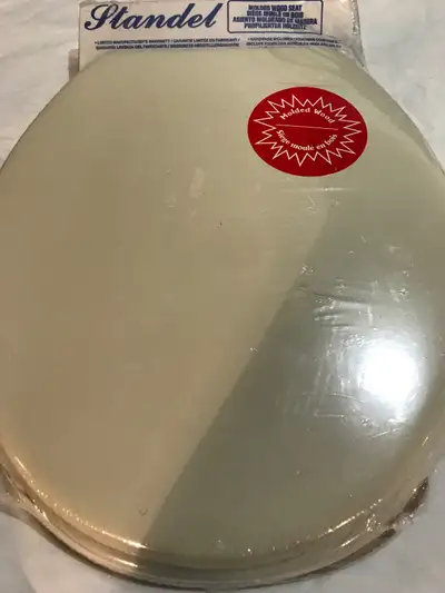 This is a brand new Standel Champagne 014 moulded wood toilet seat. Still in its original packaging,...