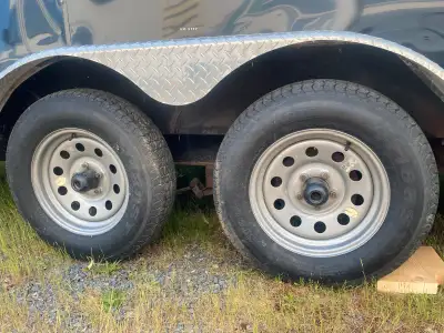 8’x16’ enclosed cargo trailer by Forest River. Ramp gate, dual axles, lined walls. Very few miles.